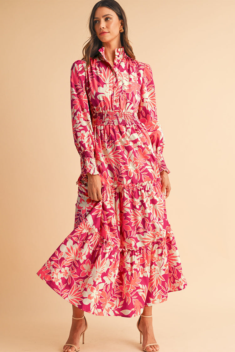 Full front view of a rose red floral tiered maxi dress on a standing model.