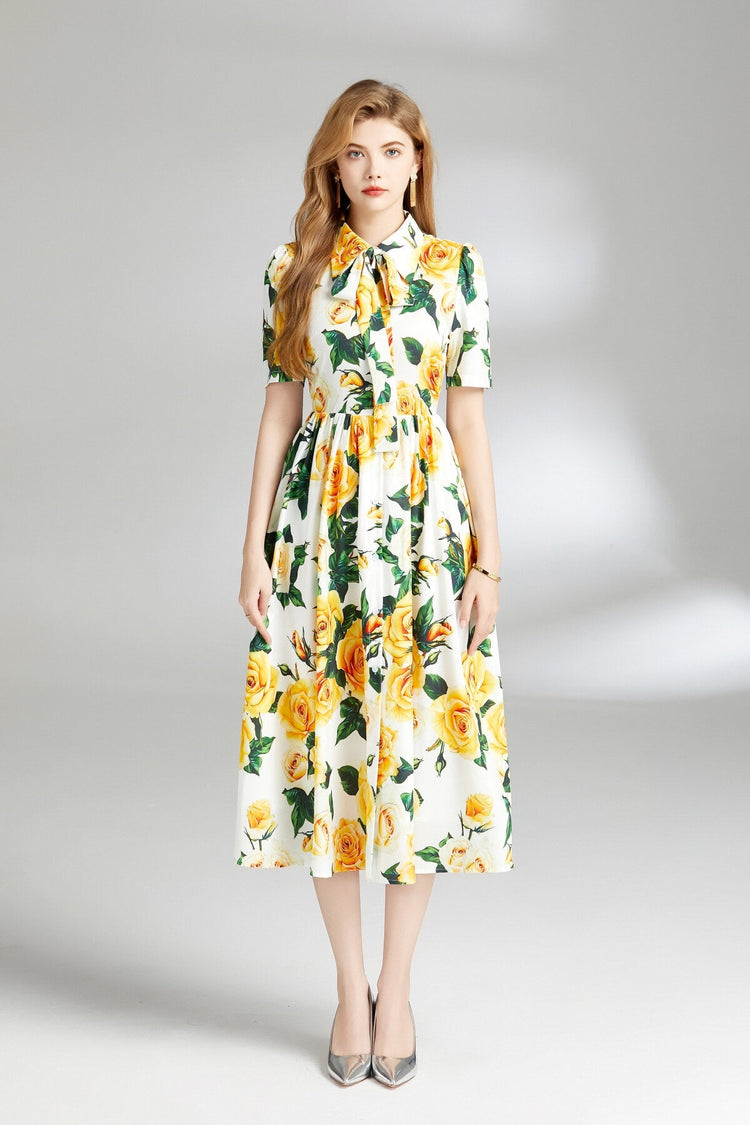 Women wearing a spring yellow floral midi dress with short sleeves.