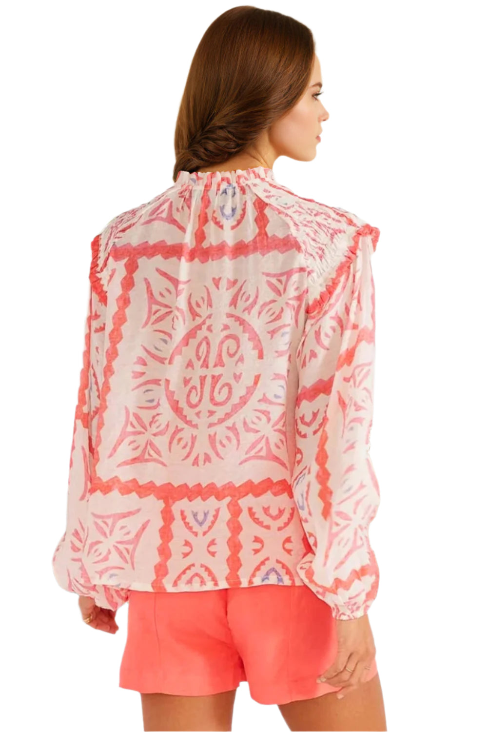 Light orange abstract print with long puff sleeves. Back view.
