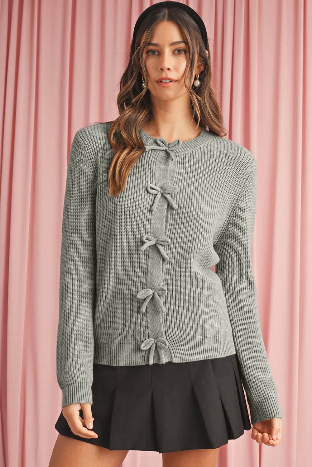 Ladies Cardigan with Bow Fronts. Gray colour. Front view.