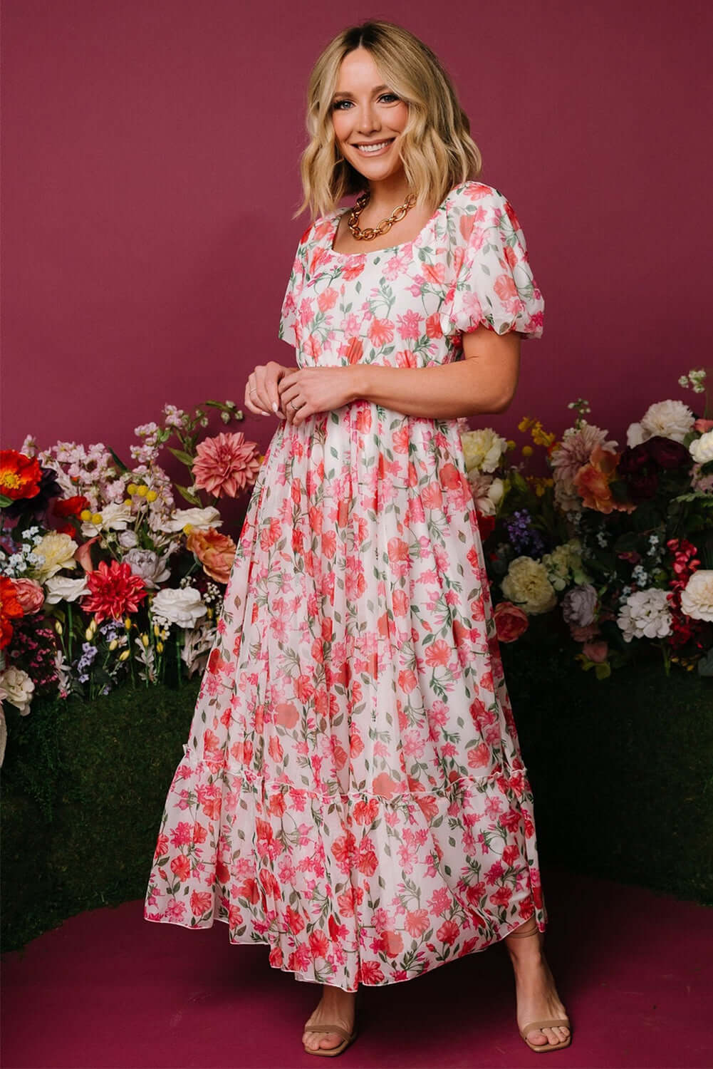 Elegant Pink Floral Puff Sleeve Dress. Romantic indoor setting.