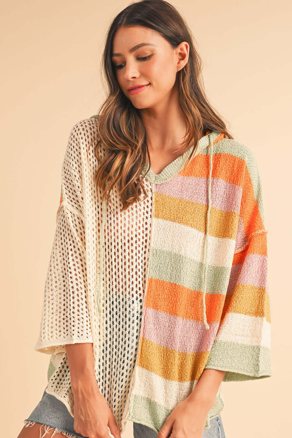 Relaxed fit open-knit jumper with a hood, great for beach days and breezy evenings
