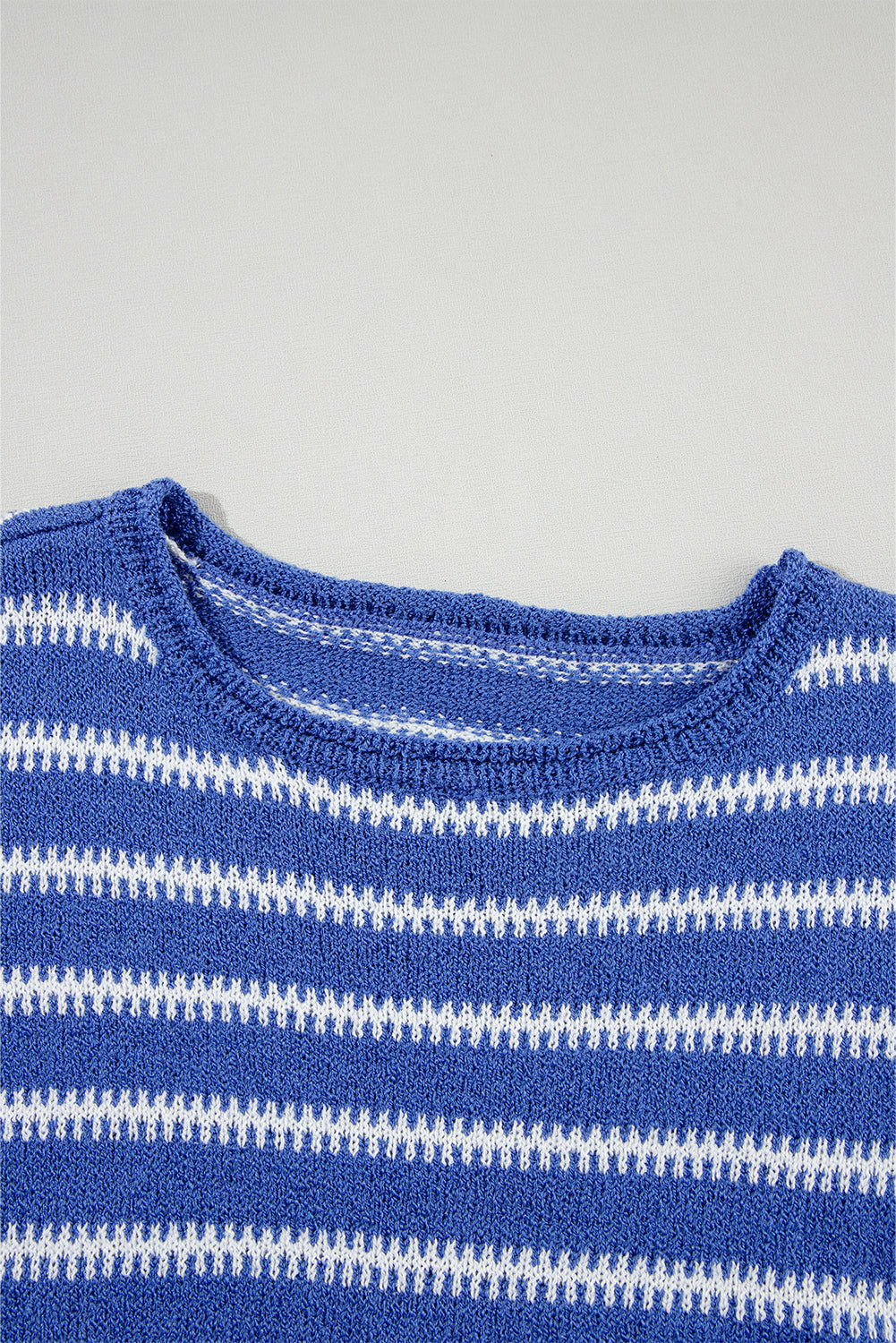 Close-up of the soft knit fabric and stylish stripe pattern.