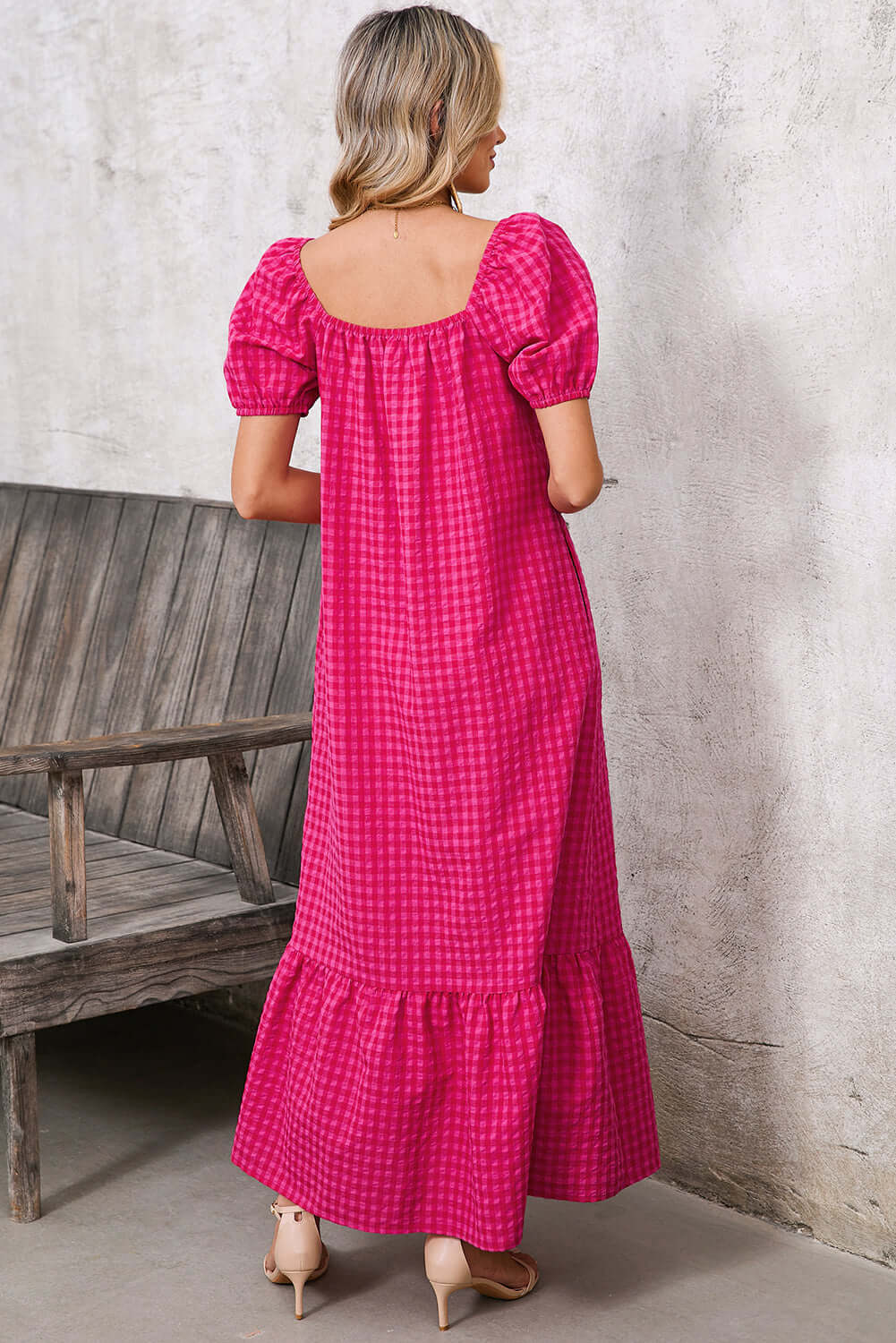 Side view of a relaxed-fit maxi dress in rose gingham, perfect for summer outings.
