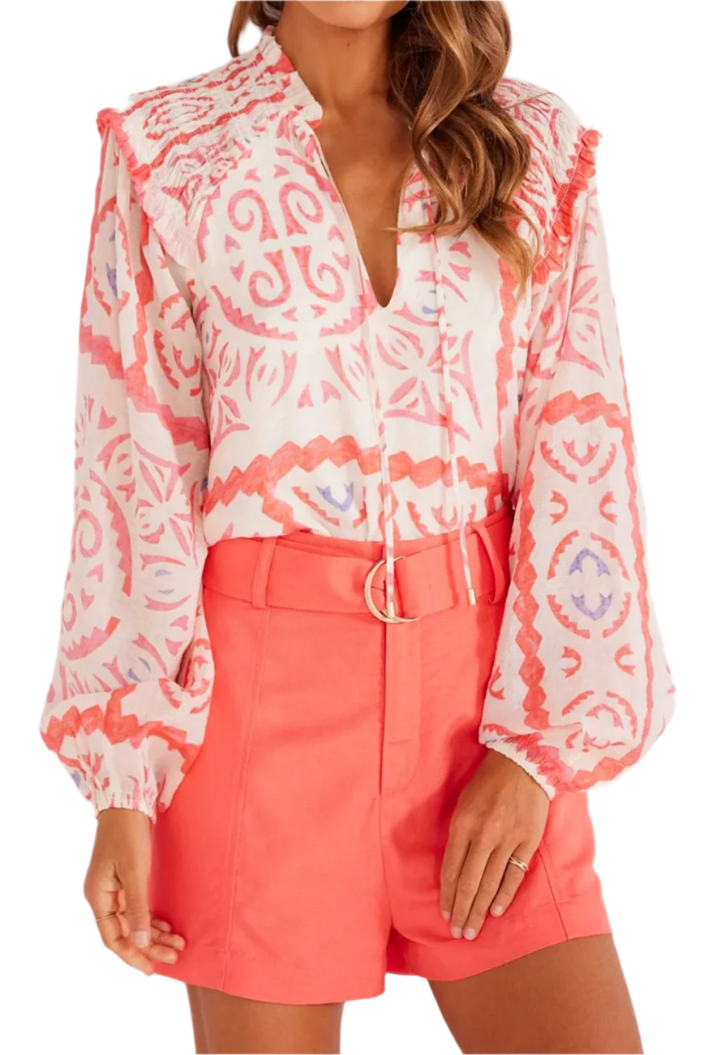 Light orange abstract print with long puff sleeves.