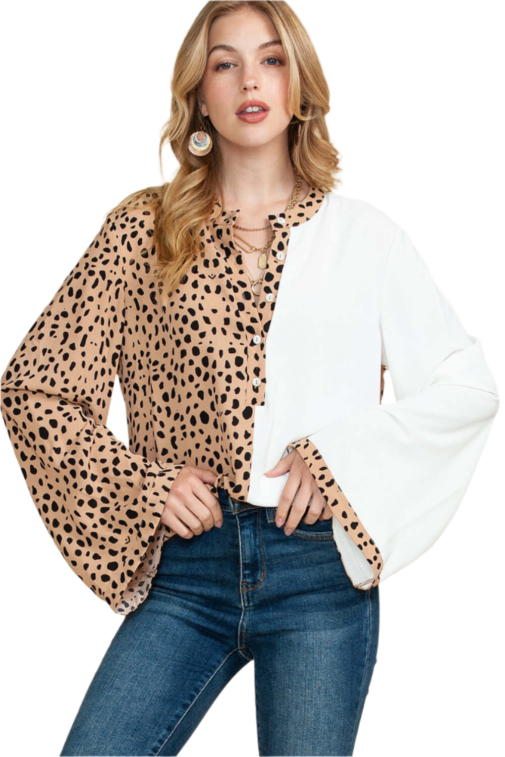 Front view of standing model wearing khaki leopard print blouse with flared long sleeves, paired with blue jeans for a casual look.