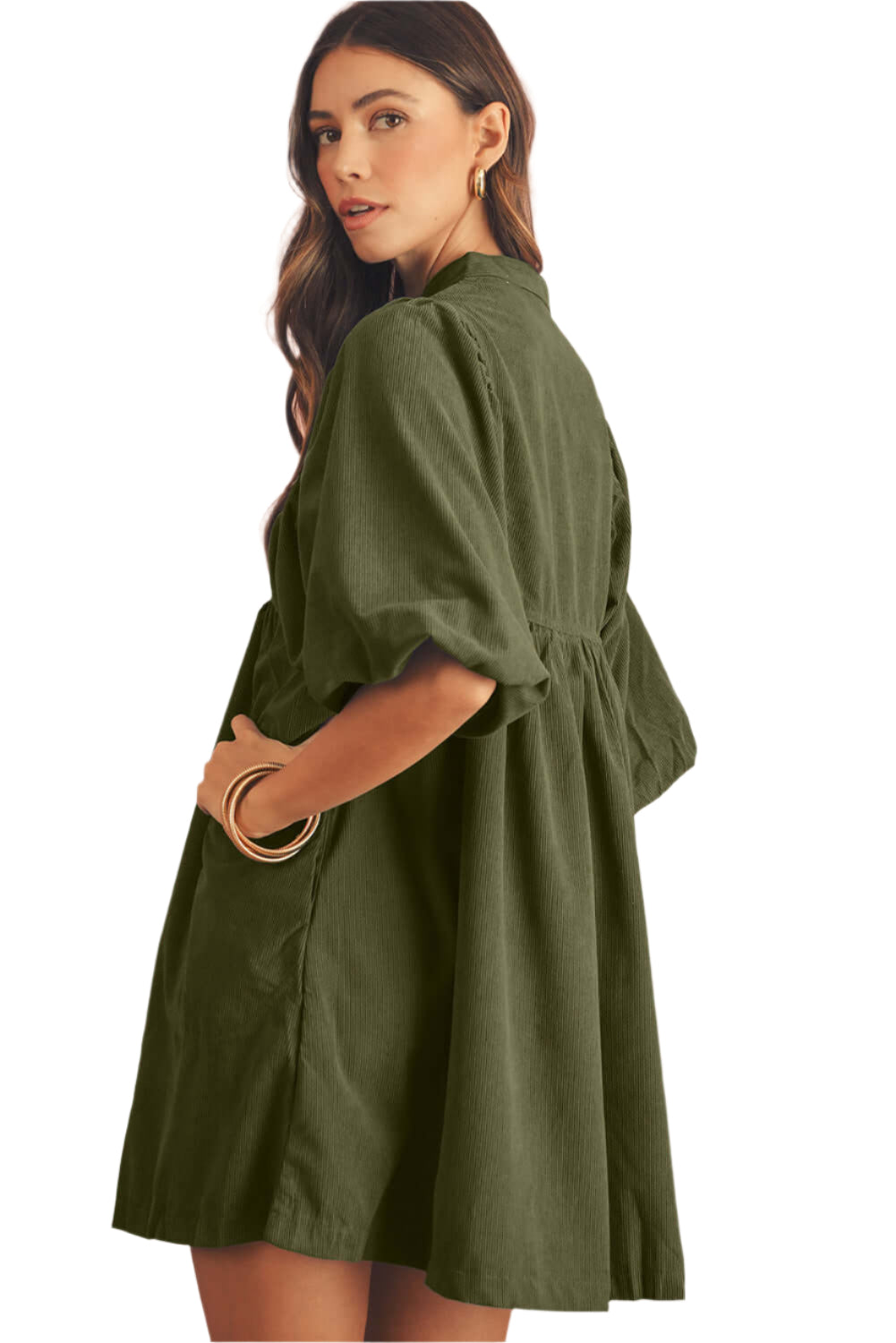 Side view of of an olive green babydoll mini dress with puff sleeves on a beautiful model , perfect dress for spring occasion.