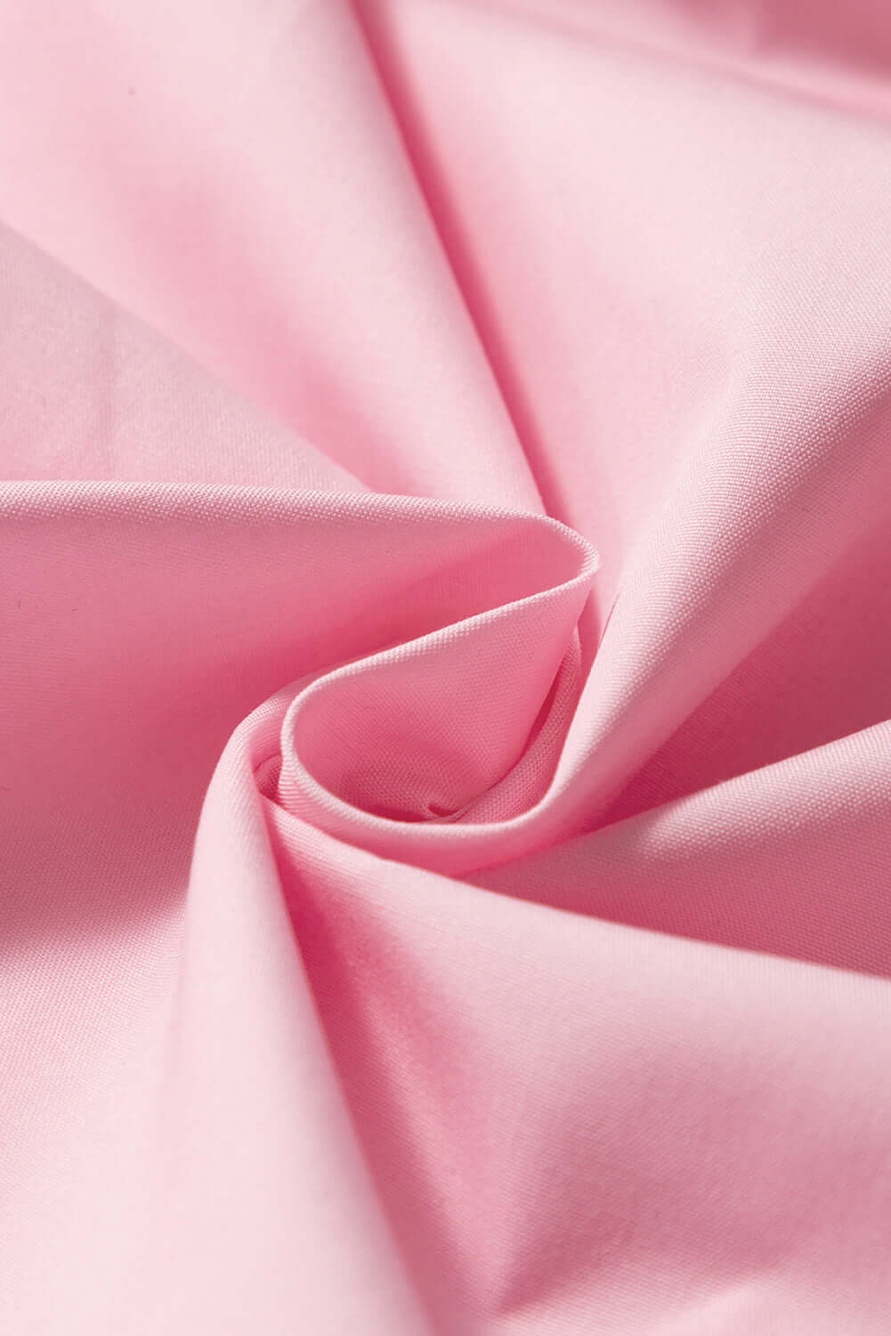 Close-up of pink tiered camisole showing delicate ruffles and breathable fabric.