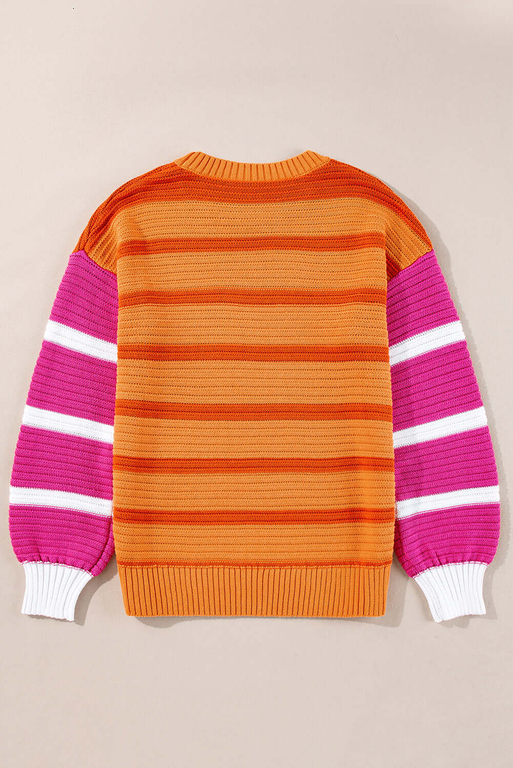 Soft and warm knit jumper featuring vibrant multicoloured stripes. Back view.