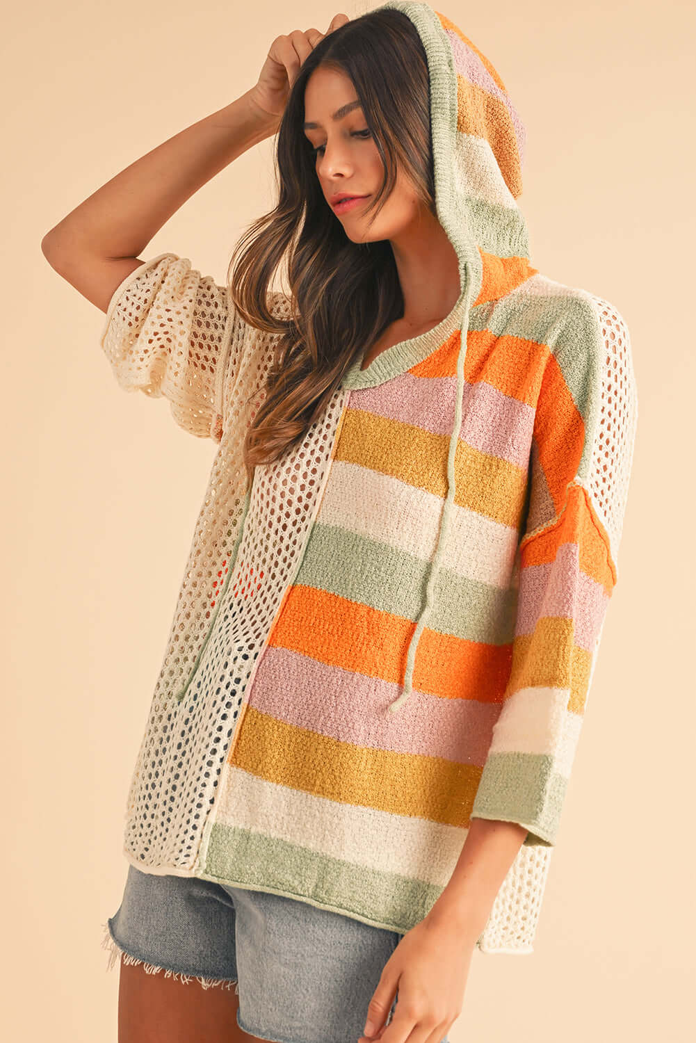 Women's boho knit hoodie with an oversized fit and open-knit details, perfect for layering