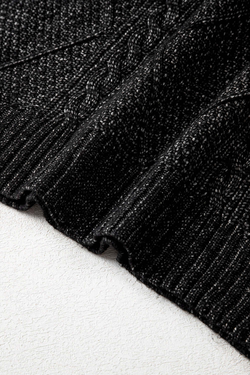Women's Black Cable Knit Jumper Dress. Dress's hem view.