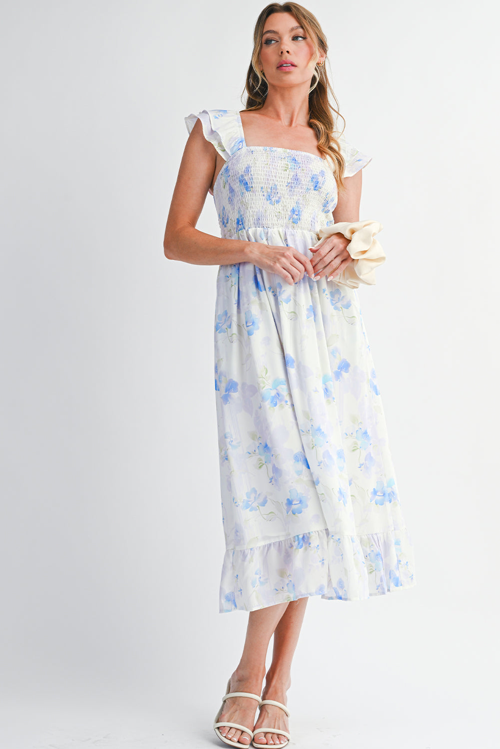 Woman wearing a floral dress on a white background