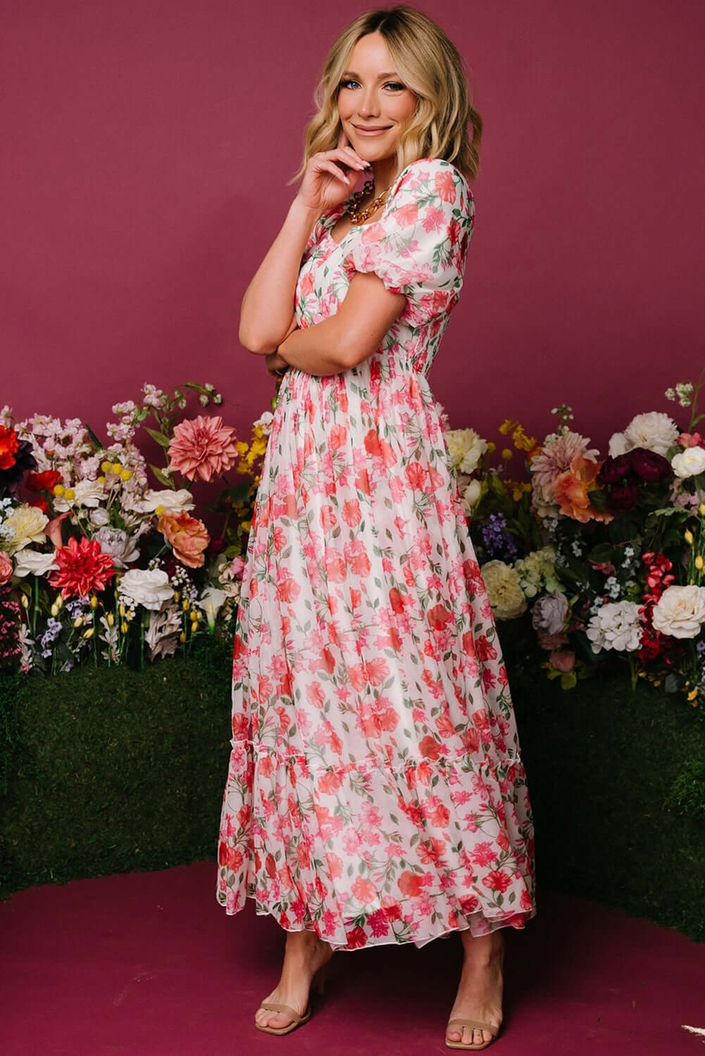 Elegant Pink Floral Puff Sleeve Dress. Slightly side view.