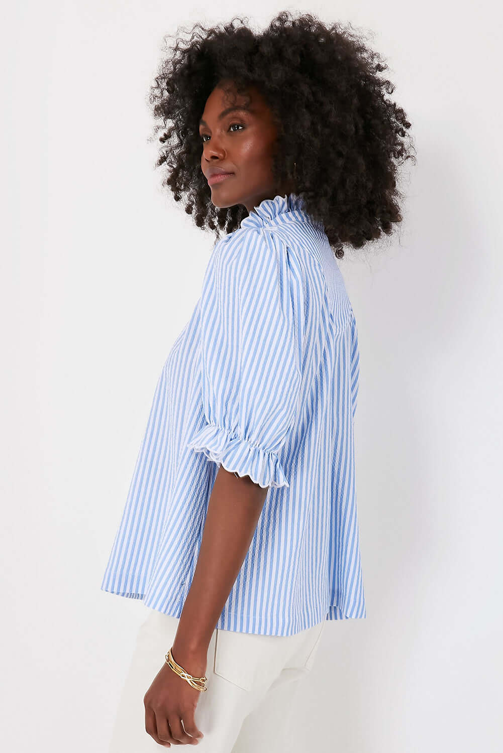 Women's Blue Striped Ruffle Top. Side view.