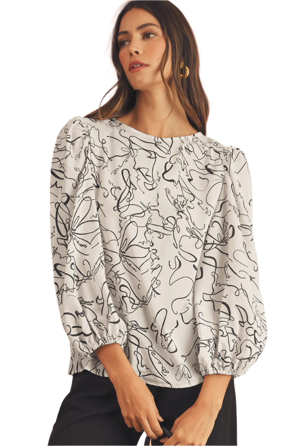 The front view of black and beige blouse, featuring crew and balloon sleeves.