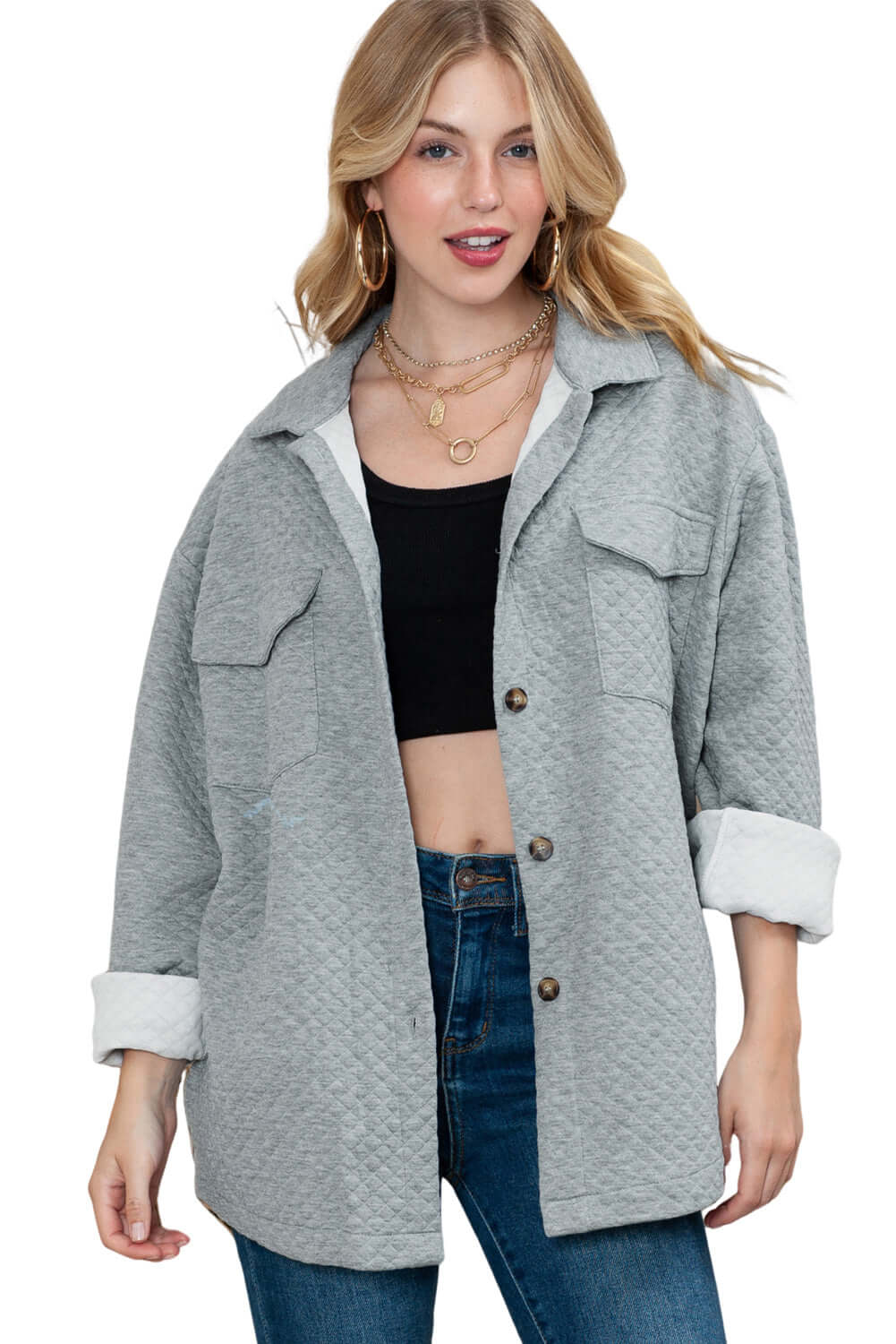 Model layering the jacket over jeans and a knit for a cosy autumn look.