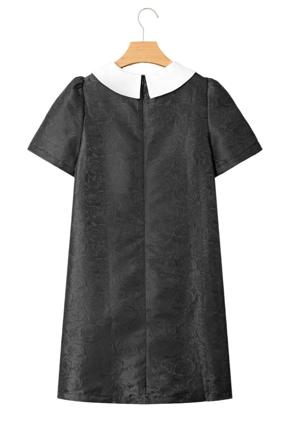 Back view of the black mini dress with puff sleeves and a concealed zipper.
