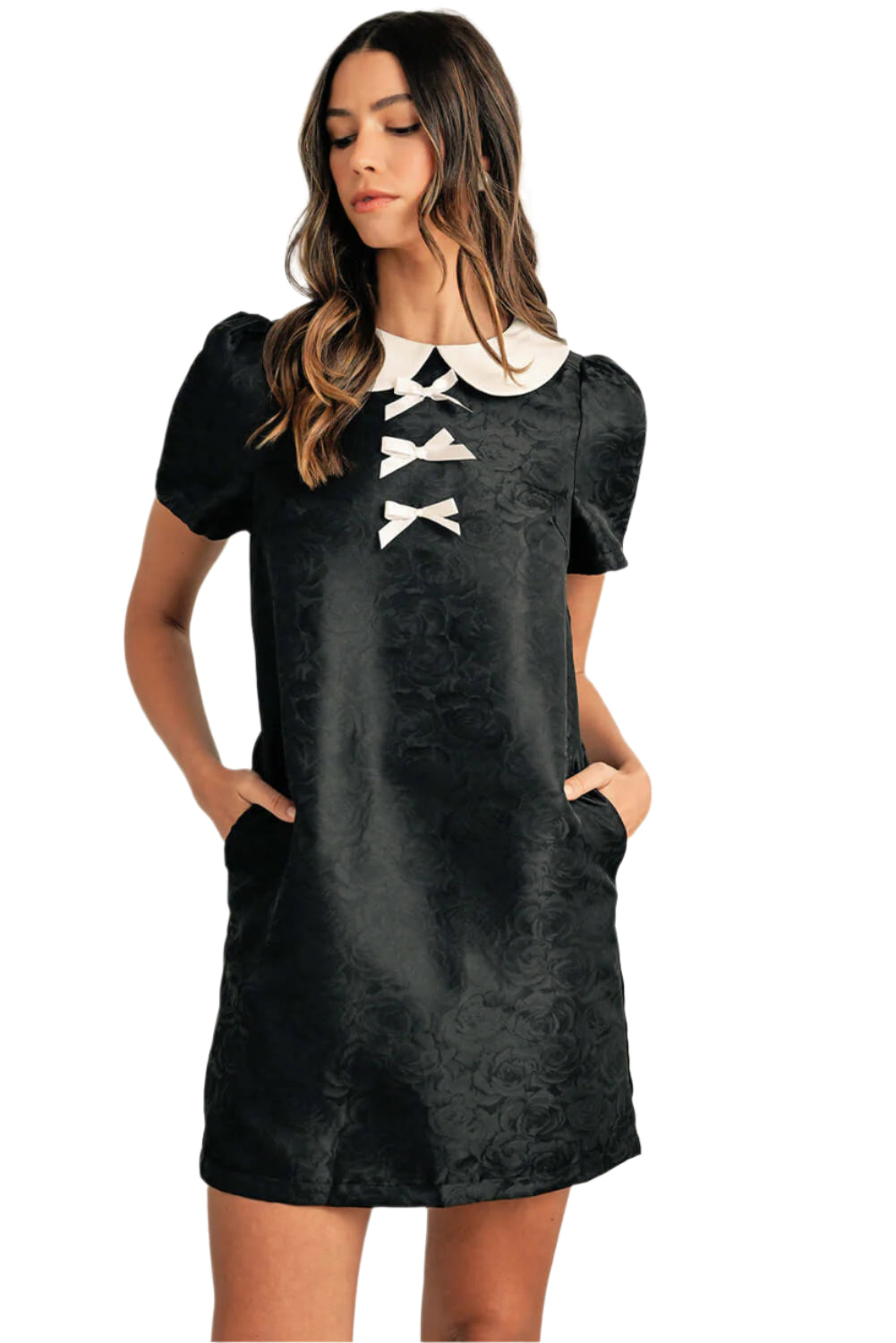 Showing the full silhouette of the front mini dress on a model.
