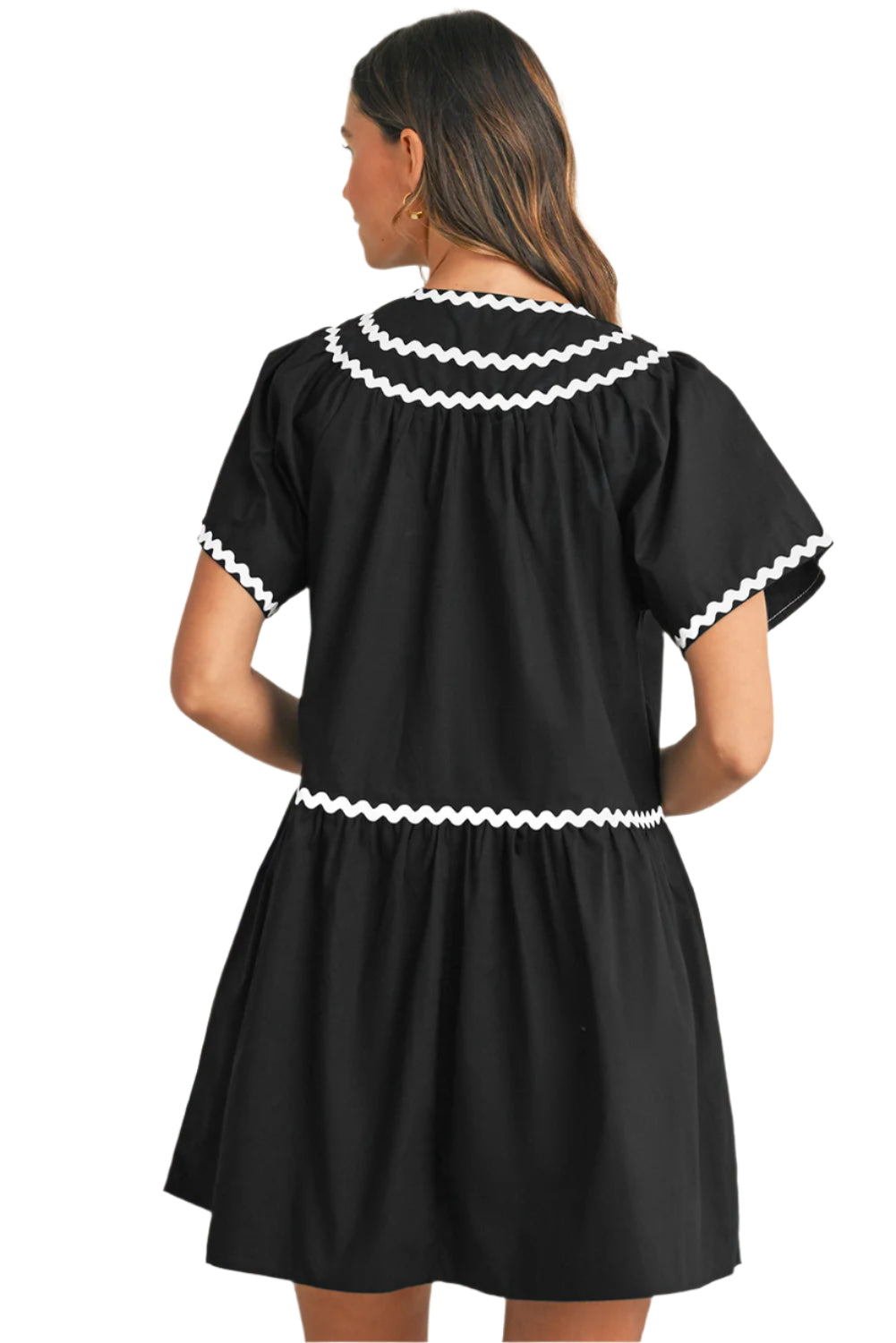 Black view of a black mini dress with ric rac details.