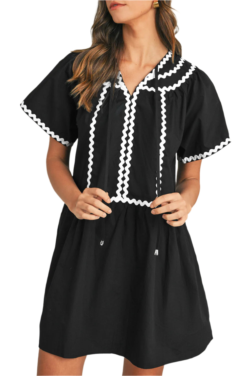 Black V-neck mini dress with ric rac details and bell sleeves.