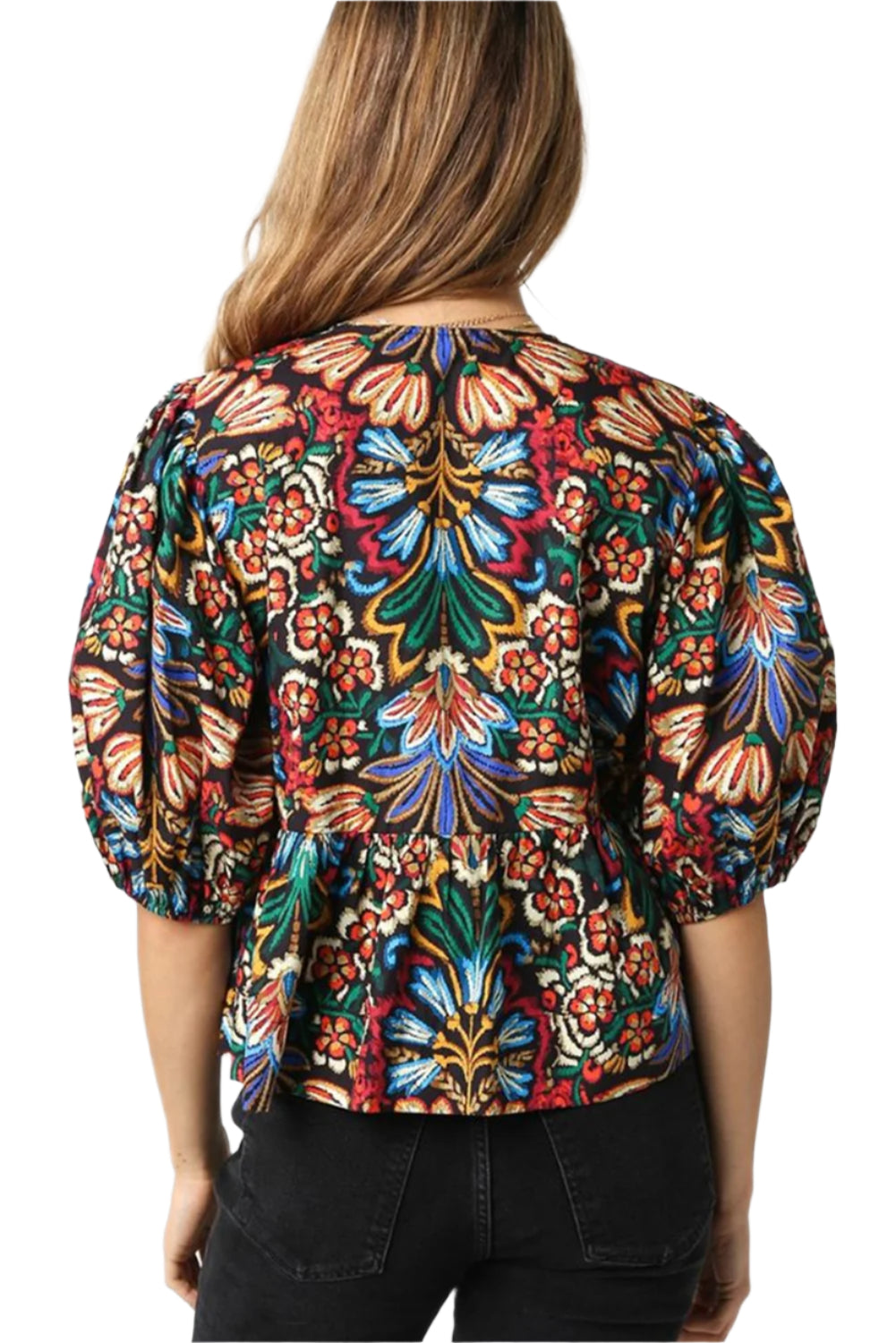 Back view of boho floral blouse with puff sleeves.