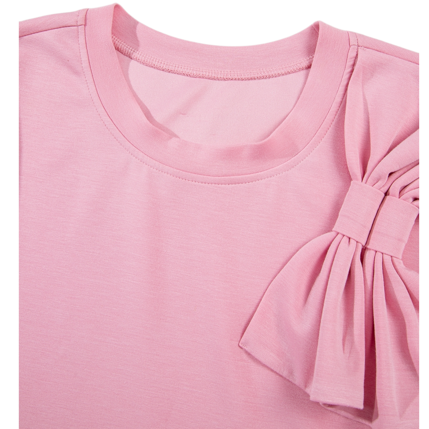 Pink top with a bow detail on a white background