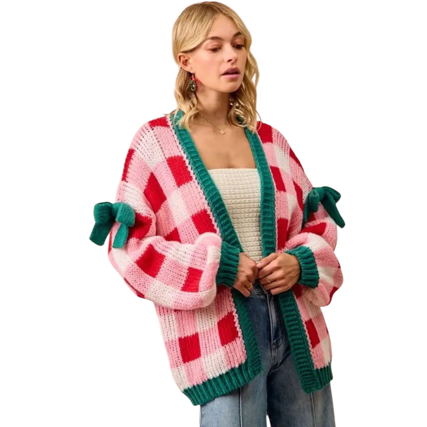 Woman wearing a colorful checkered cardigan with green accents on a white background