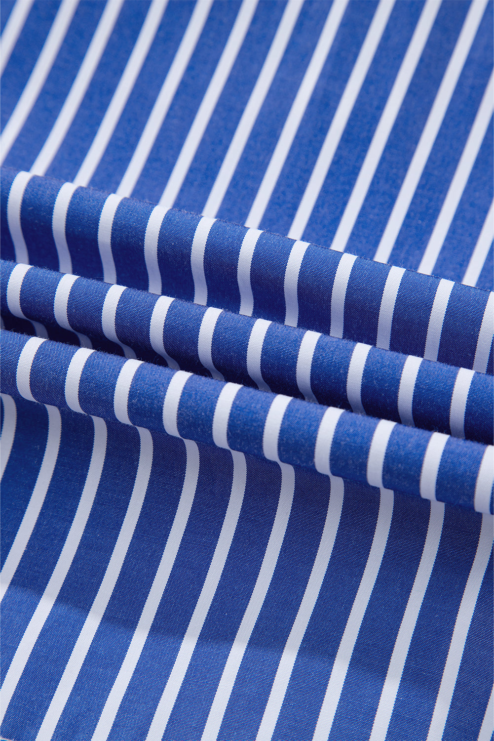 Fabric view of a bow tie blue stripe with puff sleeves.