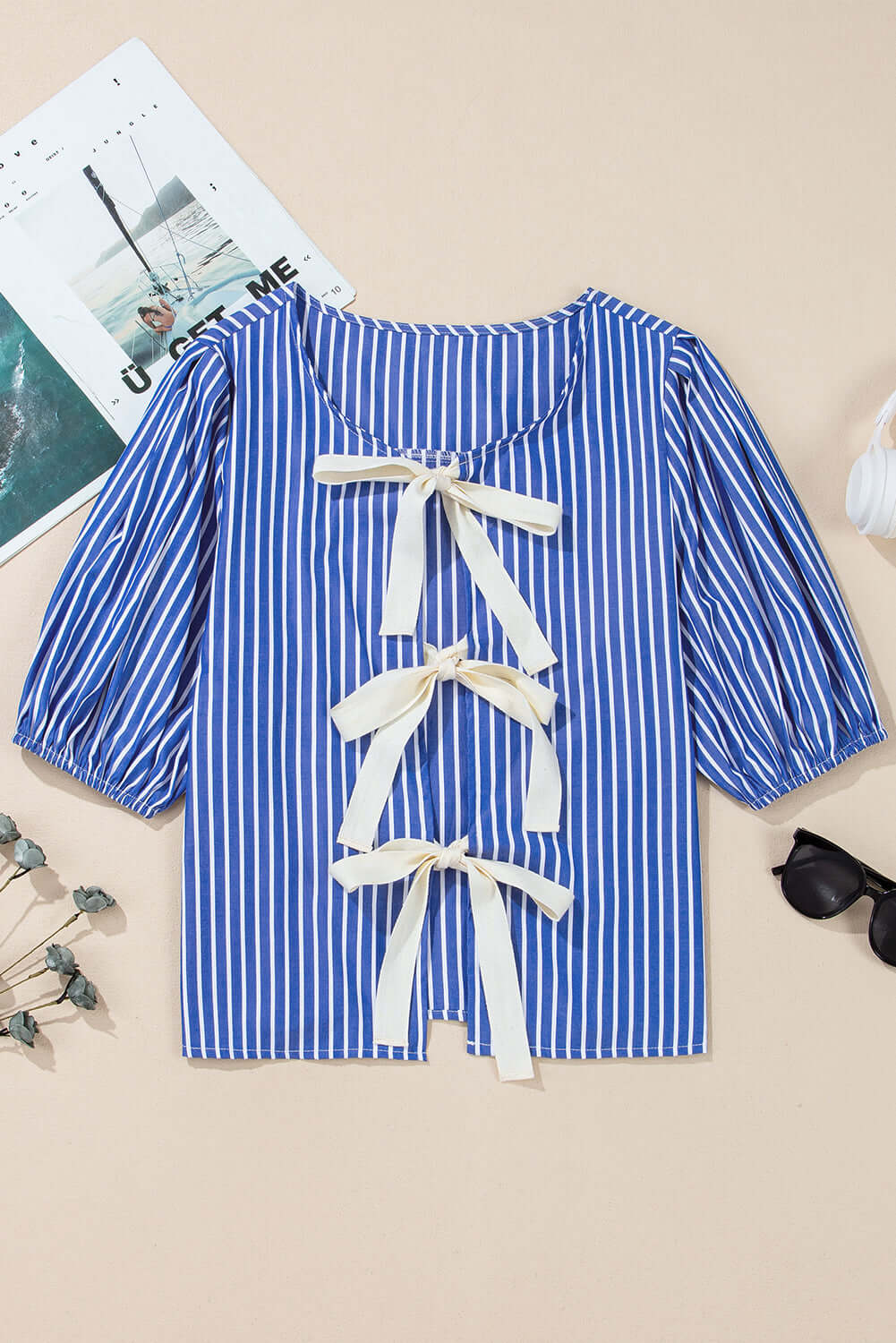 Front view of a bow tie blue stripe with puff sleeves, ideal for casual summer outings.