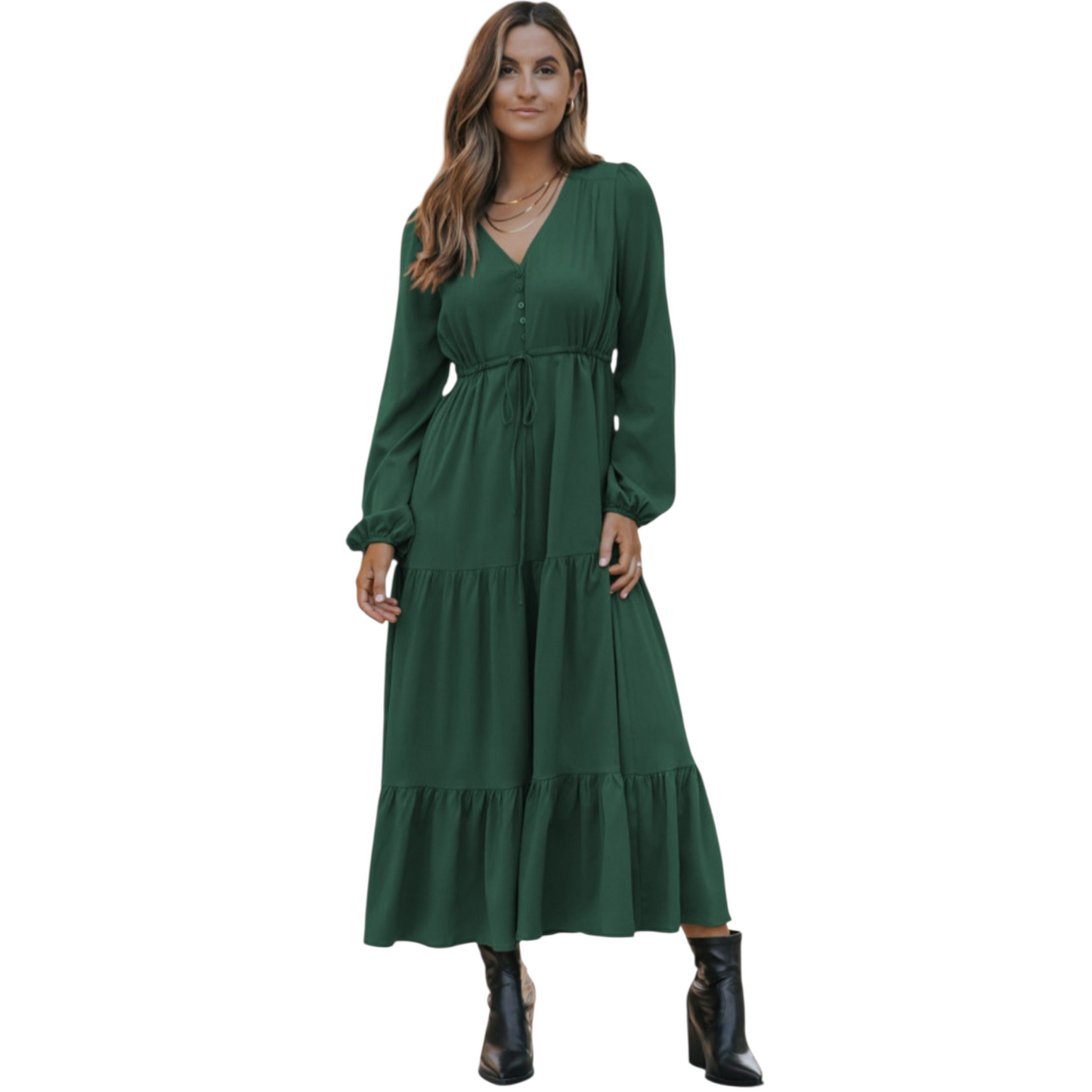 Woman in a green, long-sleeve, tiered maxi dress with a V-neckline and drawstring waist, paired with black ankle boots