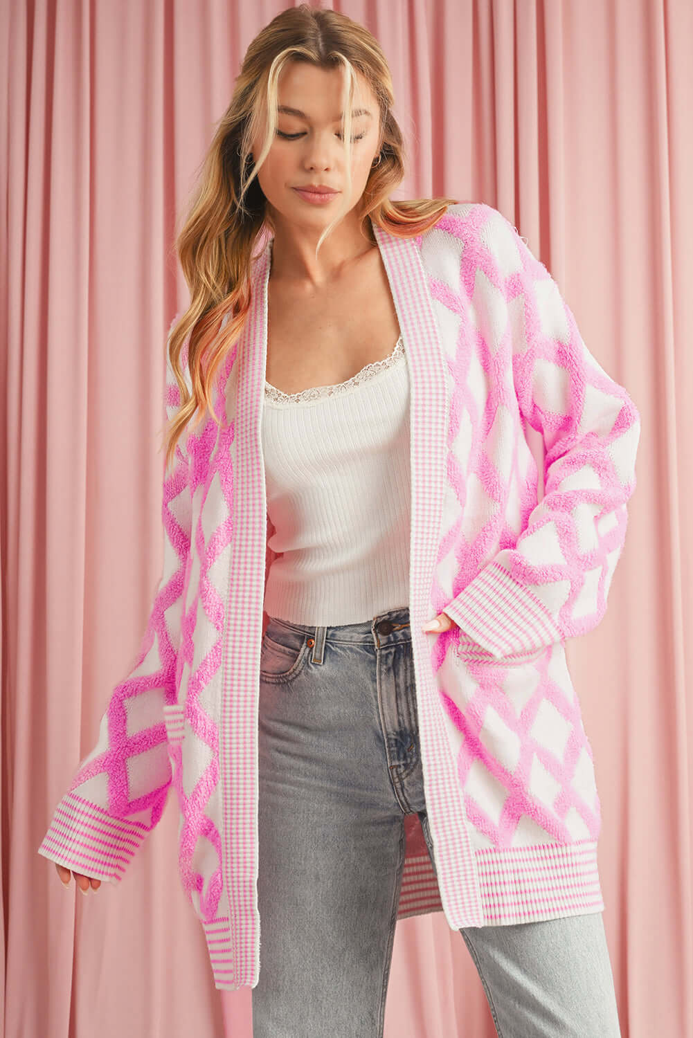 Soft and warm pink longline cardigan styled for a chic winter look.