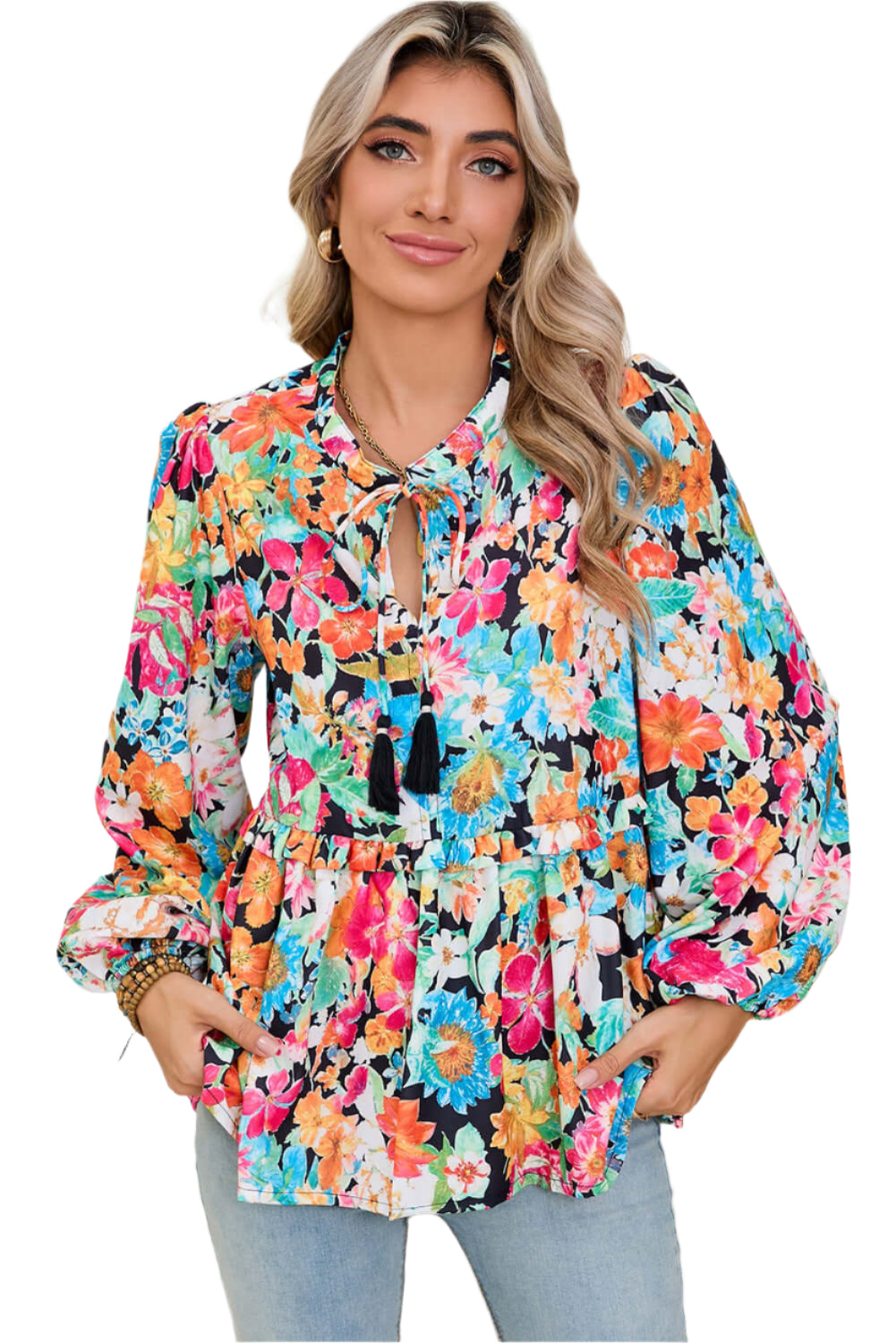 Half view of model wearing multicolour floral blouse with long lantern sleeves.