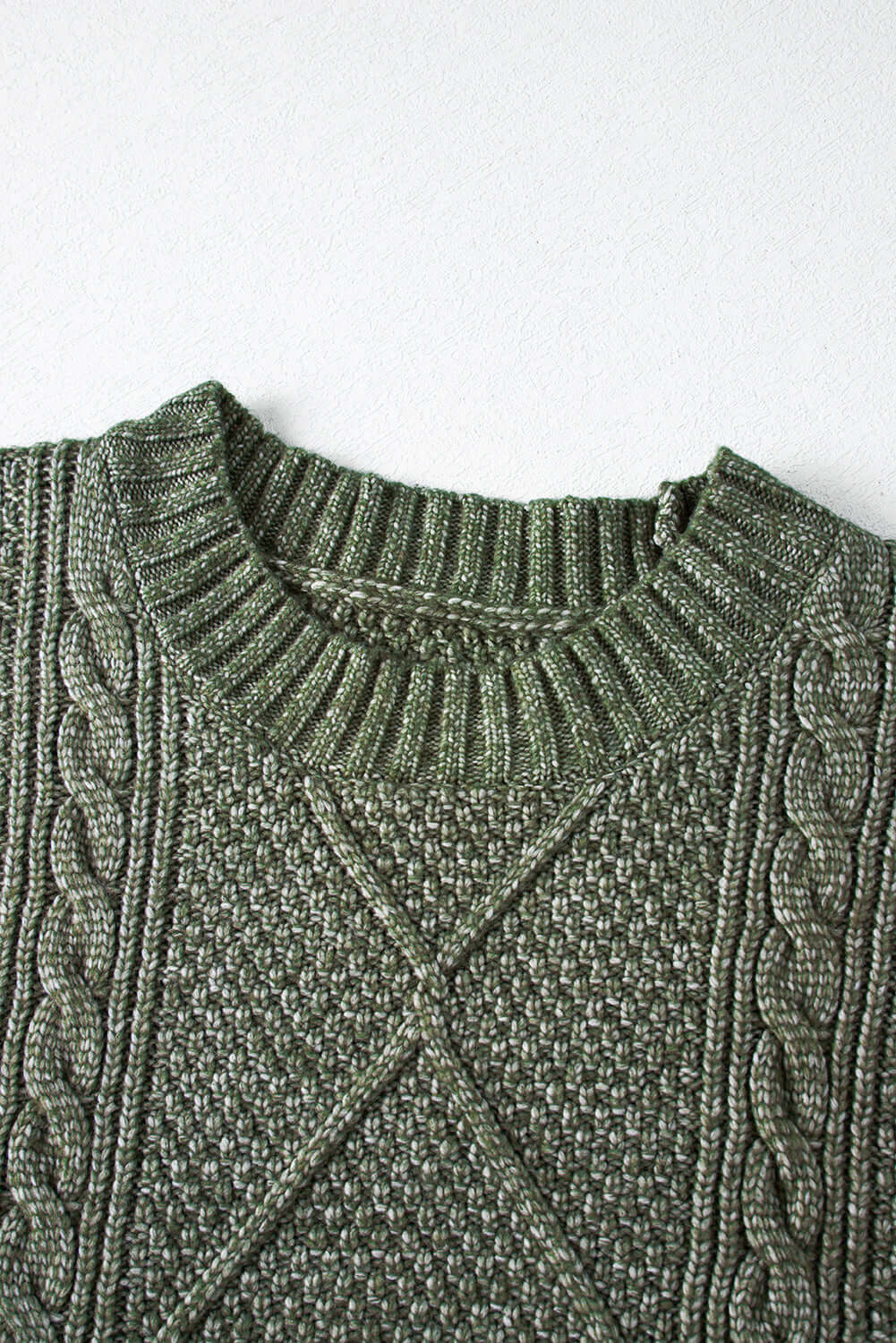 Women's Green Cable Knit Jumper Dress on the hanger. Neckline view.