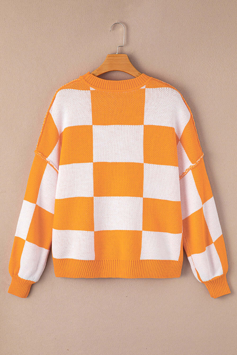 Women's Casual Check Knitted Jumper - Orange. Back view, on a hanger.