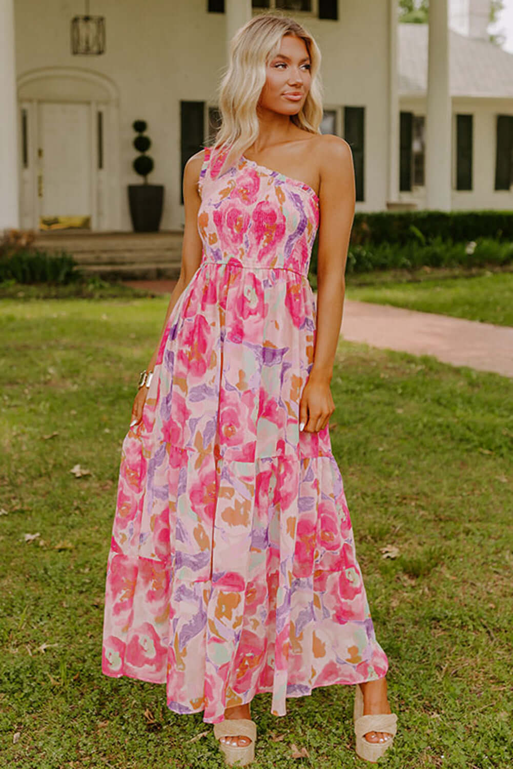 Rosy Sunset One-Shoulder Dress. Front view. Outdoor setting.