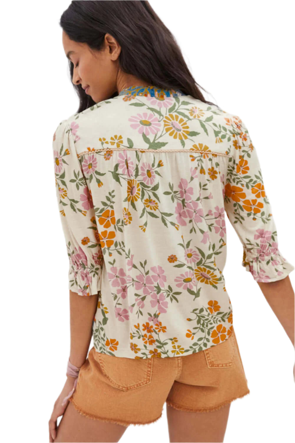 Back view of a model wearing a multicolor boho blouse with a V-neck and half sleeves.