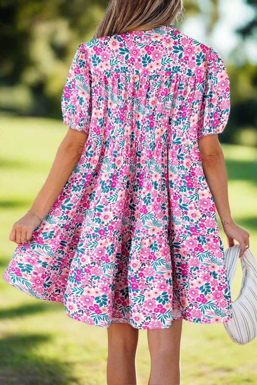 Women's Spring Garden Babydoll Dress. Back view. In a spring outdoor setting.