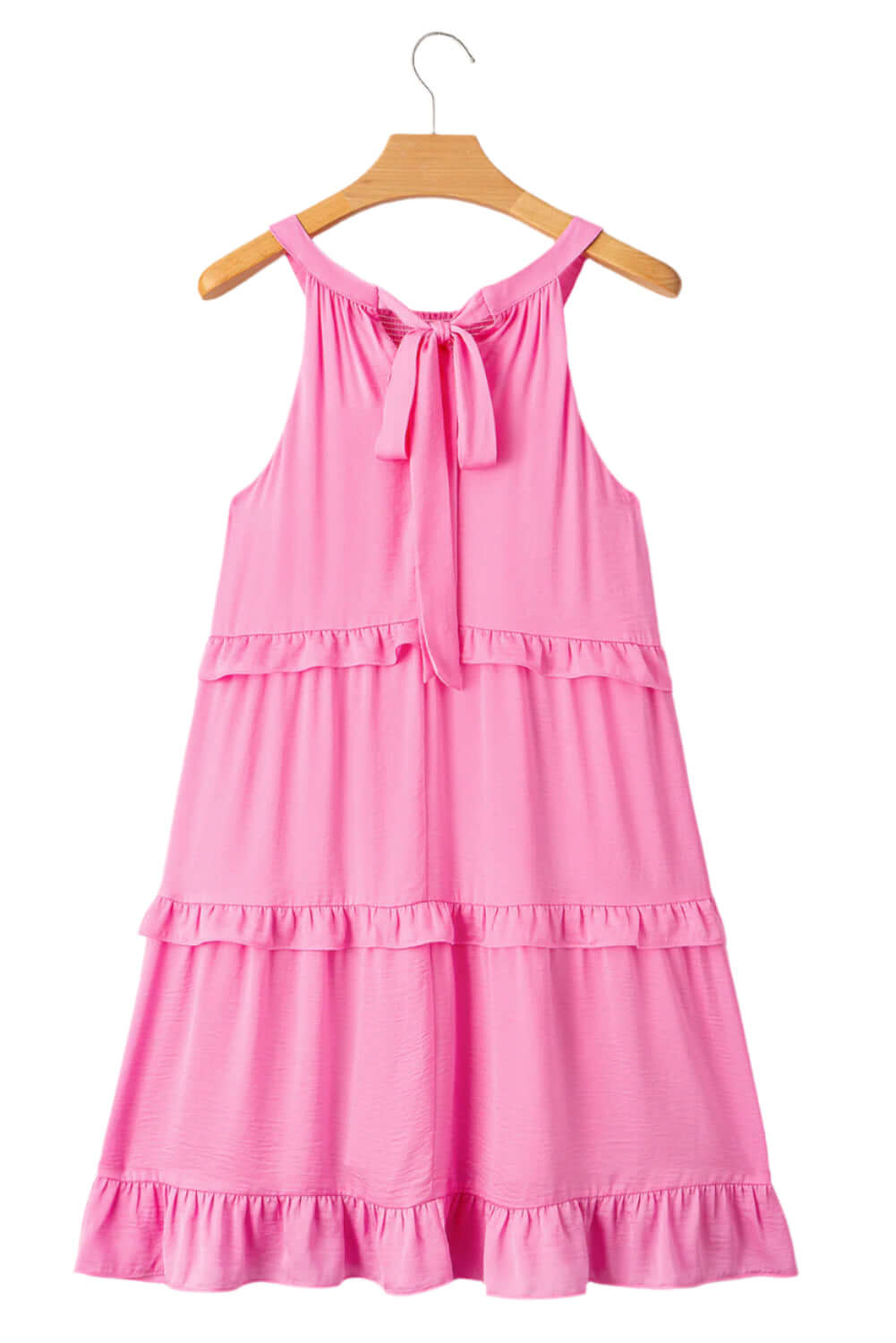 Flowy pink boho dress with tiered ruffle details, perfect for summer fashion.