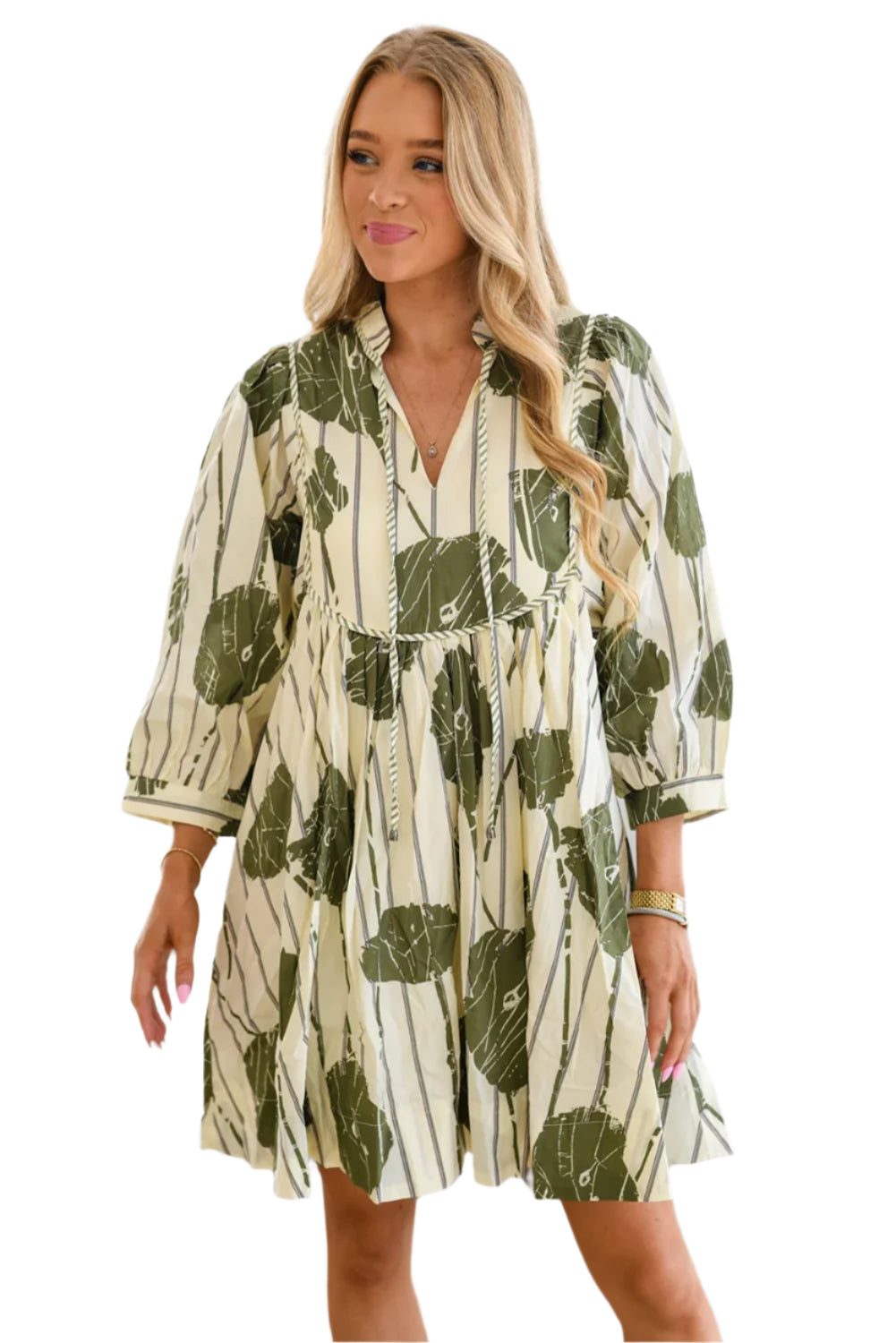 The front view of green abstract bohemian dress, featuring lace-up V-neck and 3/4 sleeves.