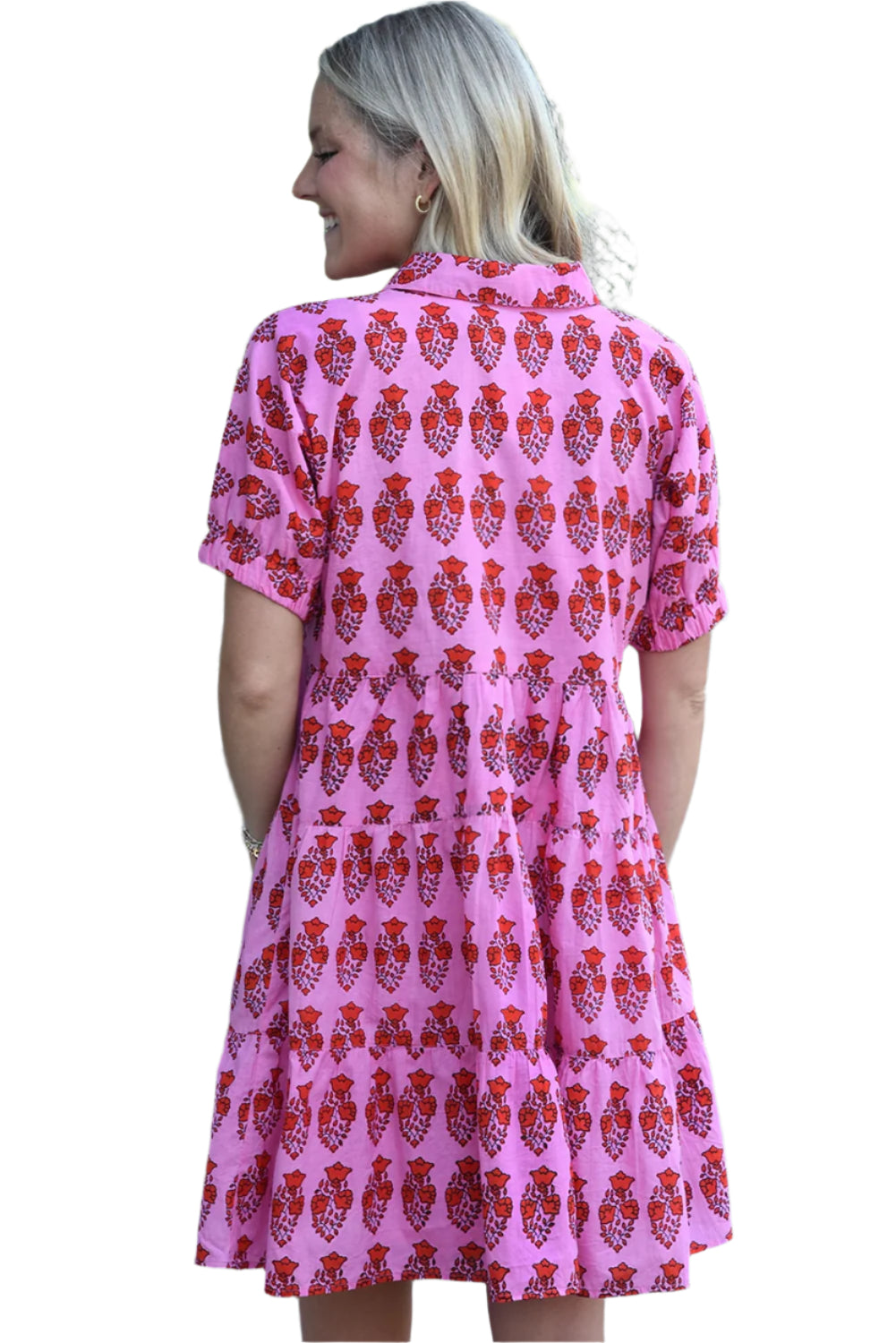 The back side of a pink floral tiered mini dress, featuring short sleeves and a tiered silhouette. Perfect for spring and summer occasions.
