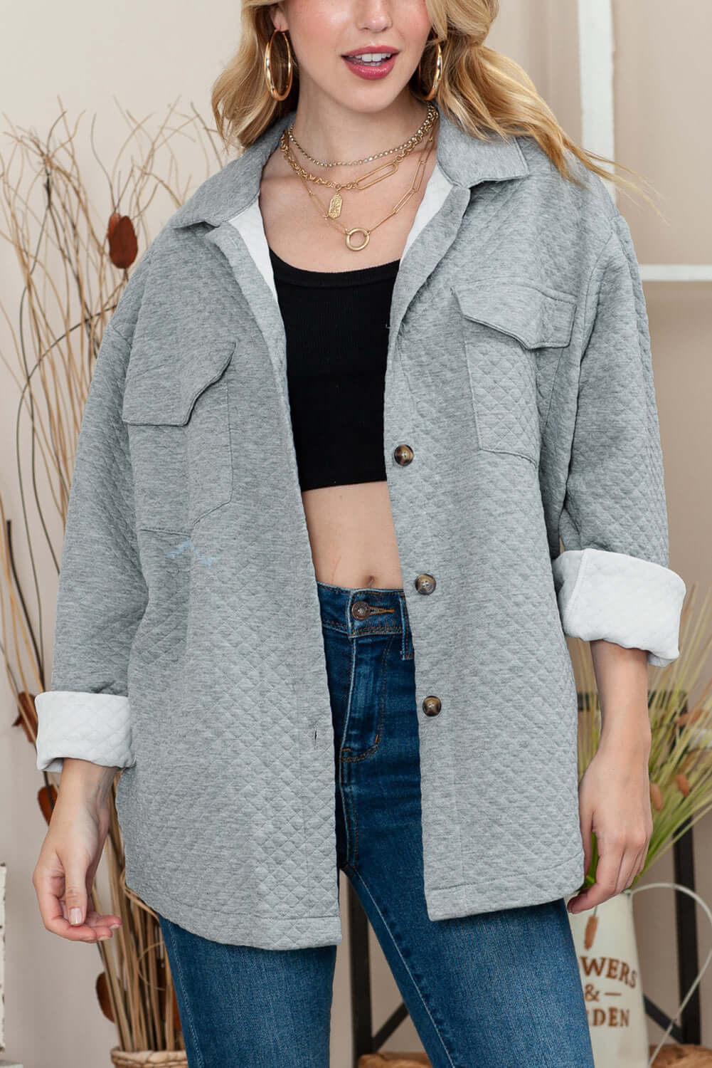 Front view of the jacket, showcasing its button-up design and flap pockets.