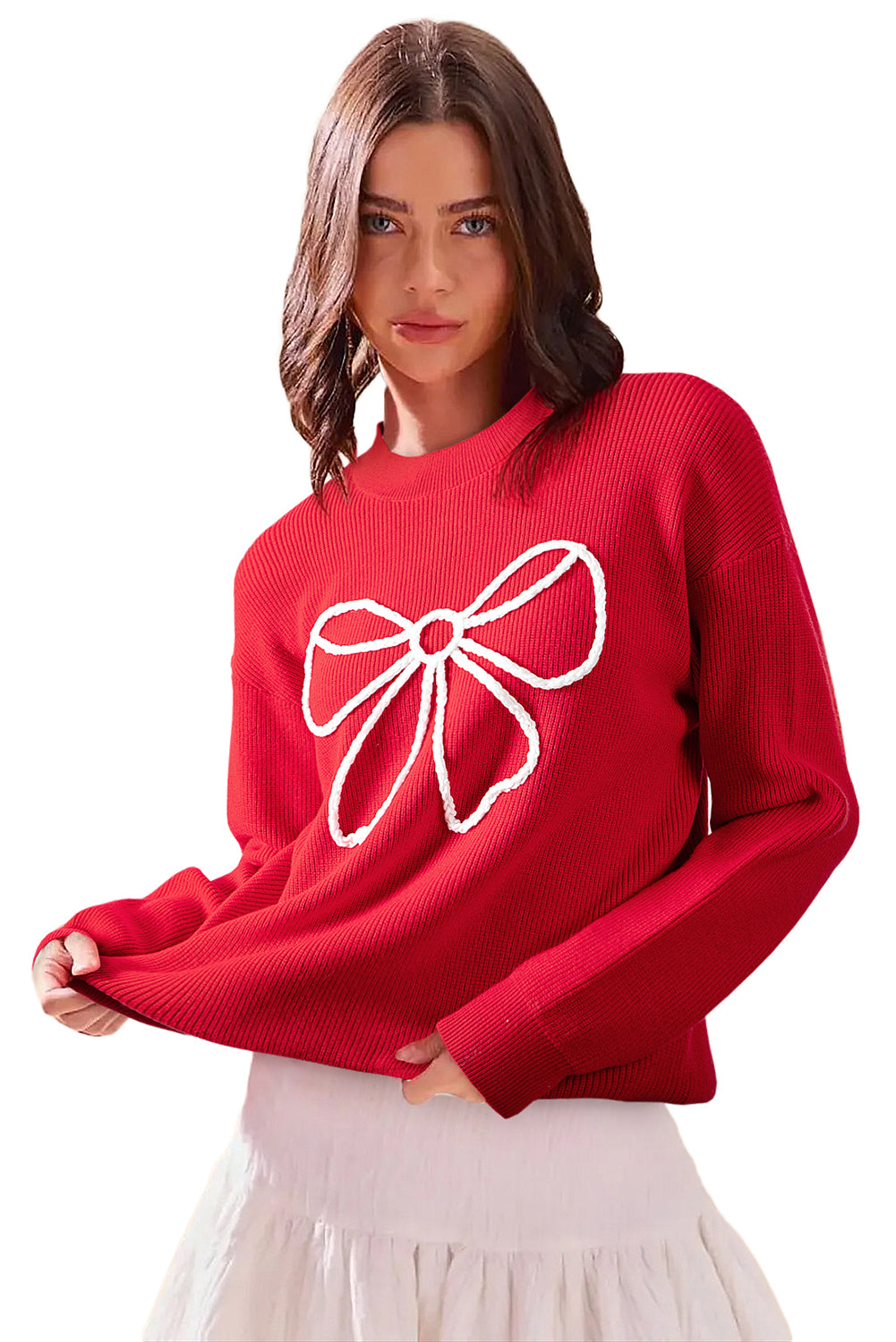 Woman wearing a red sweater with a white bow design on a white background
