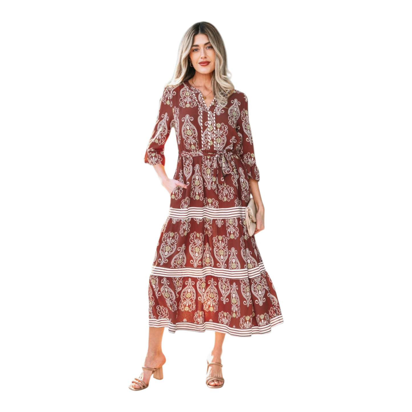 Woman wearing a rust-brown paisley floral maxi dress with a matching waist tie belt and flutter sleeves.