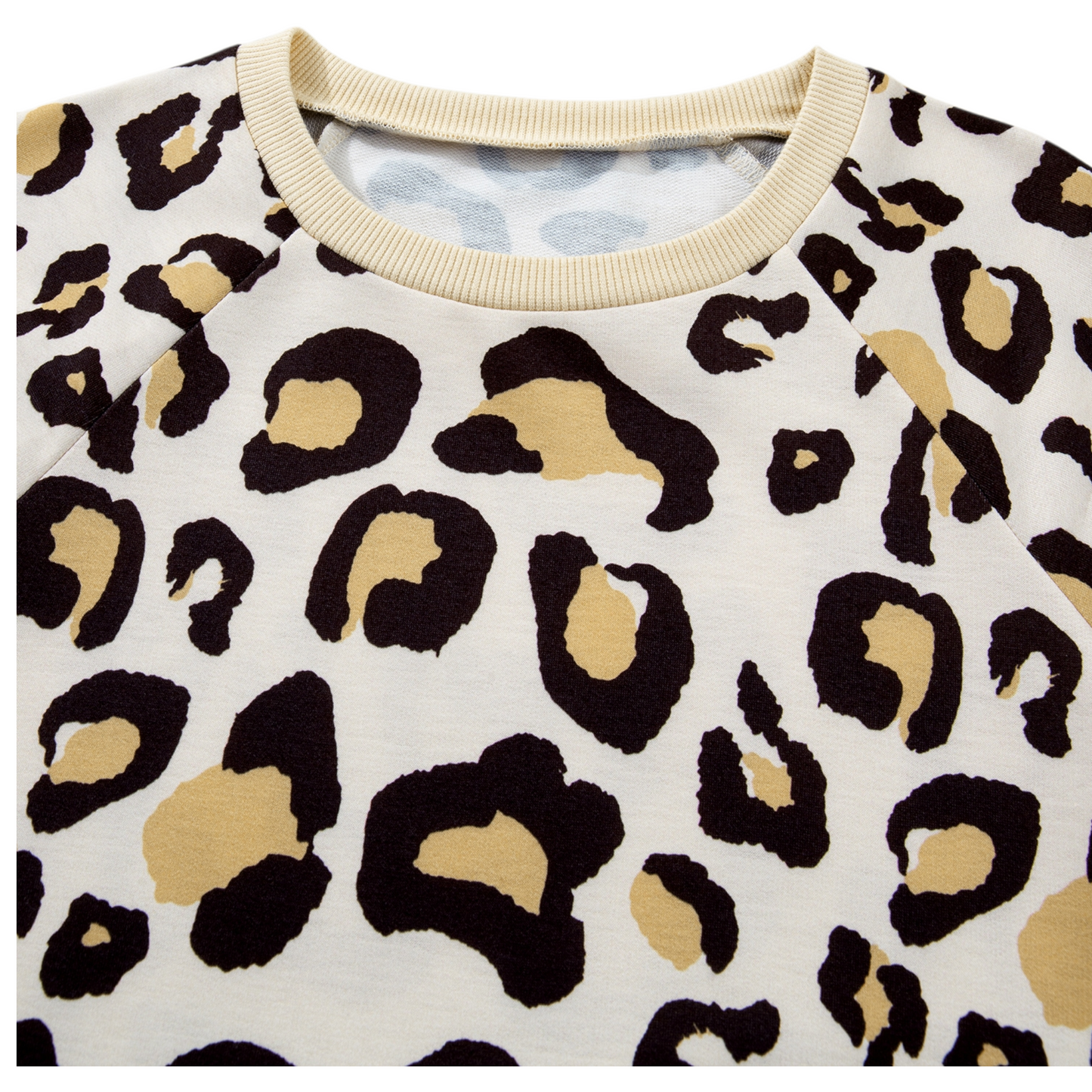 Leopard print shirt with beige trim on a white background