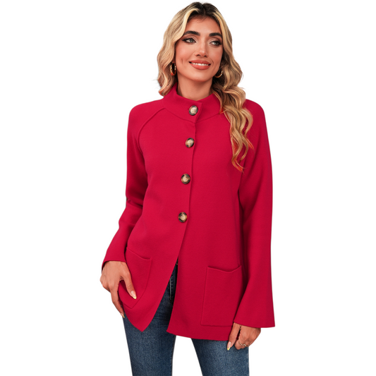 Woman wearing a red coat with silver buttons on a white background