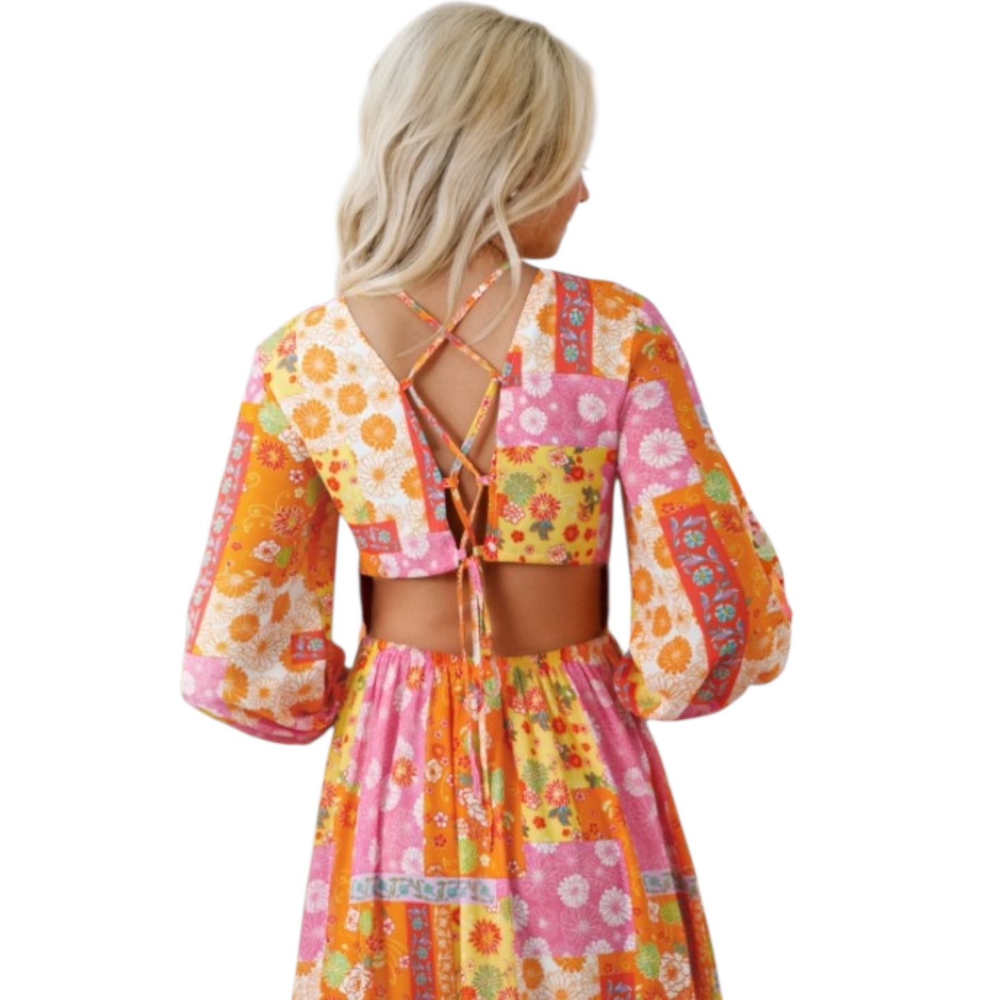 Back view of a bohemian-style maxi dress with a colorful floral patchwork print, featuring a cut-out open back and a crisscross lace-up tie closure at the top.