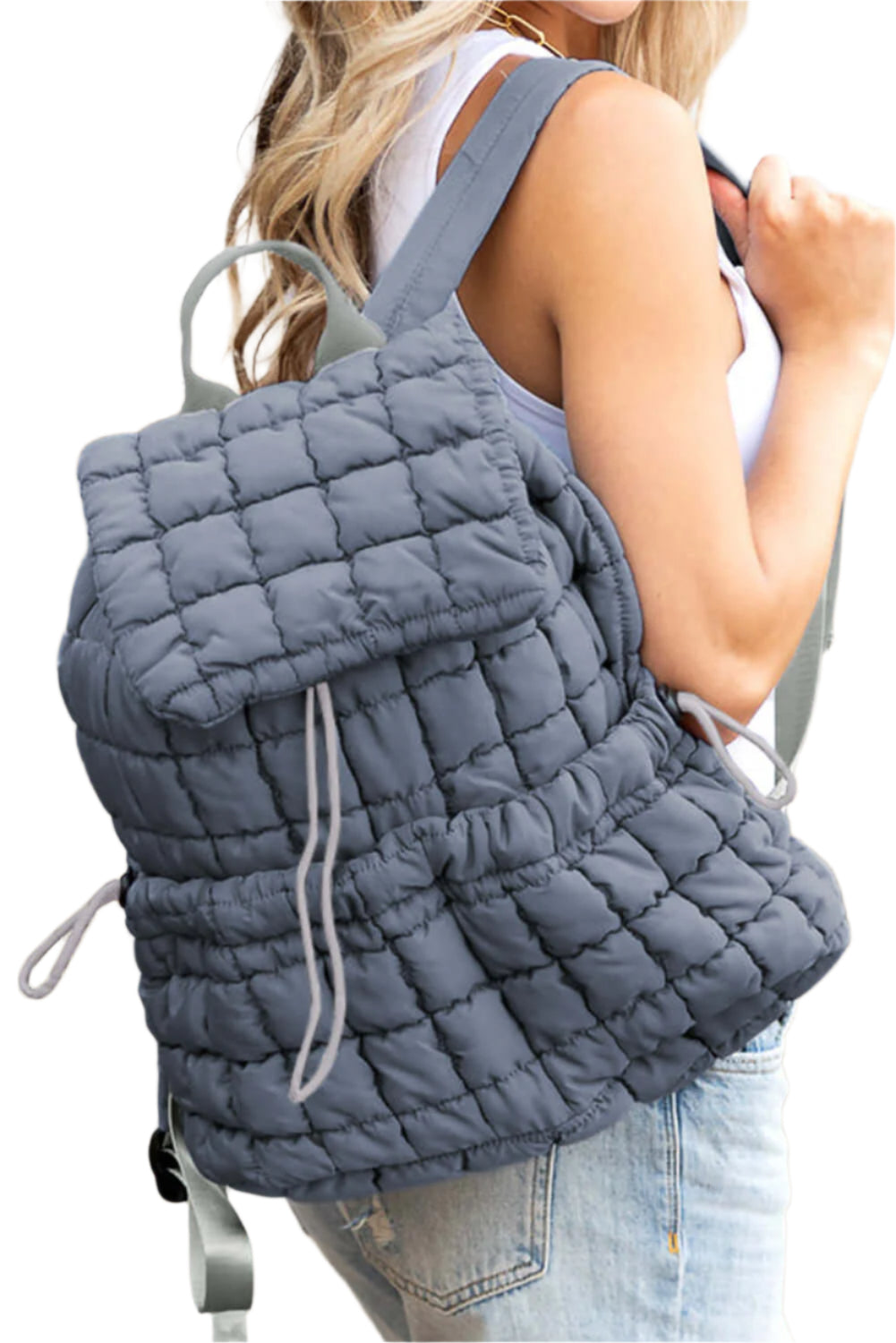 Blue quilted puffer backpack for ladies.