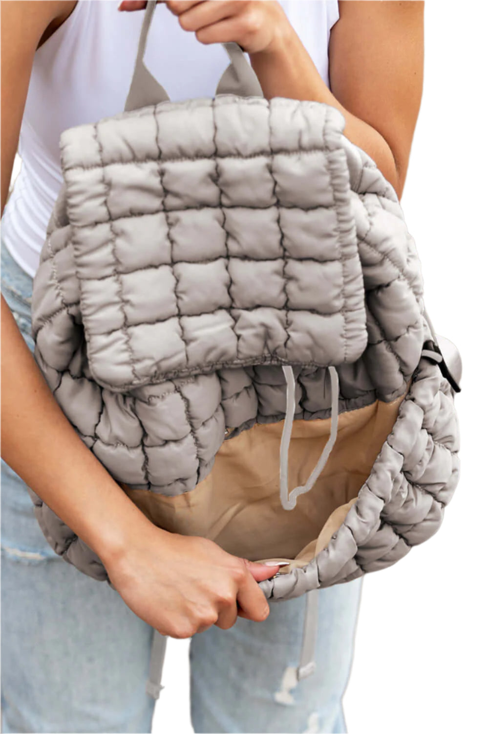 Grey quilted puffer backpack for ladies.