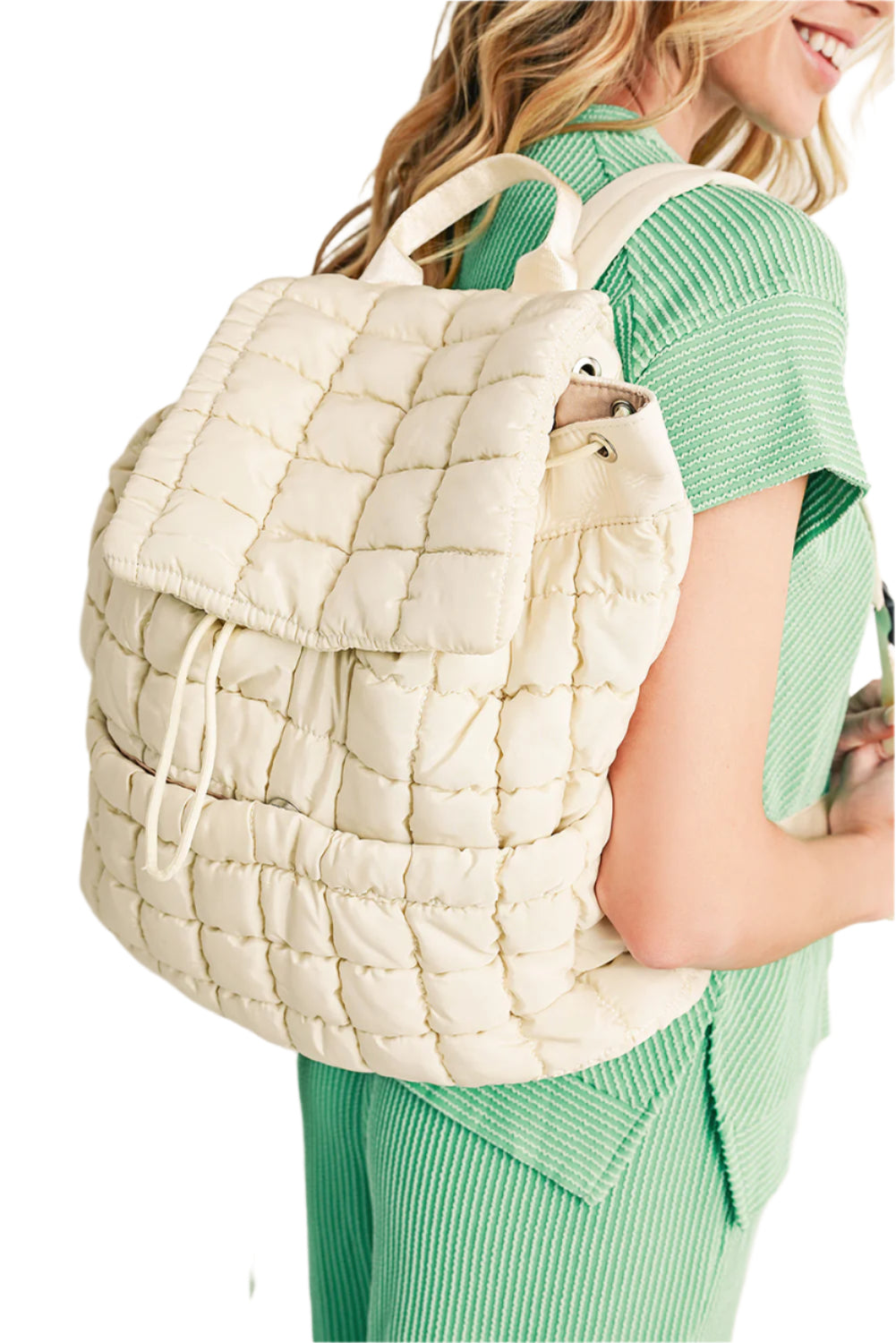 First photo of quilted puffer backpack, white color.