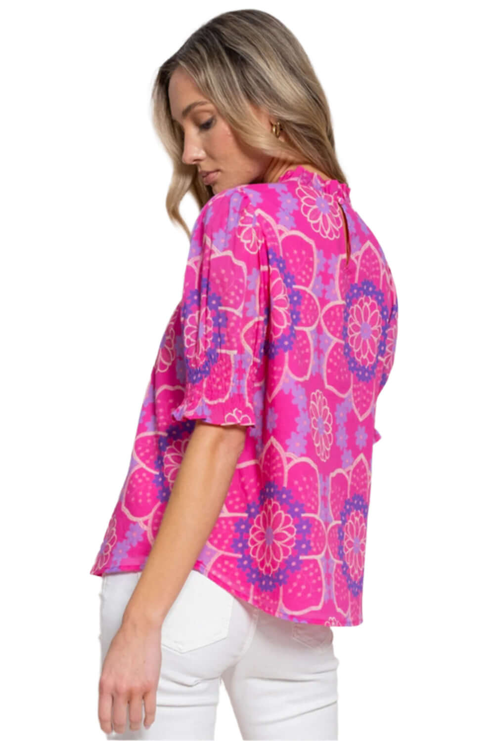 Casual floral blouse with frilled neckline and smocked cuffs.